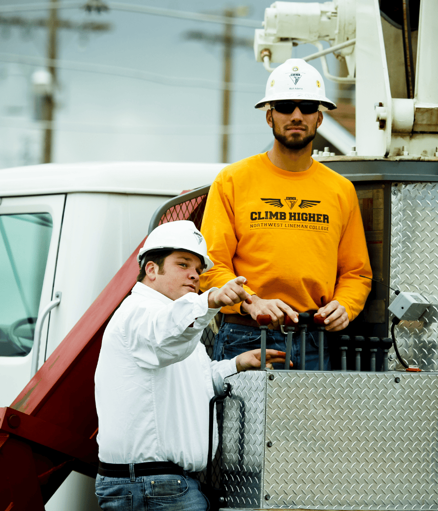 Crane Trainer and Student operating mobile crane in practical exam/test
