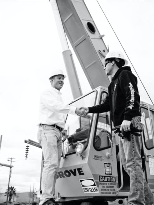 crane operator passing nccco practical exam shaking hands with trainer
